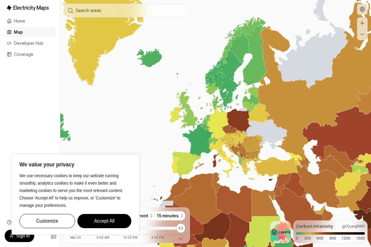 Interaktywna mapa świata pokazująca intensywność węglową sieci energetycznych z regionami oznaczonymi kolorami od zieleni (niskie emisje) do brązu (wysokie emisje).
