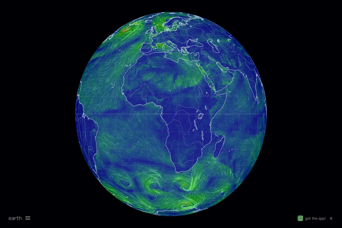 Interaktywny globus przedstawiający wzorce wiatrów w czasie rzeczywistym jako płynące zielone cząsteczki na kontynentach i oceanach Ziemi.